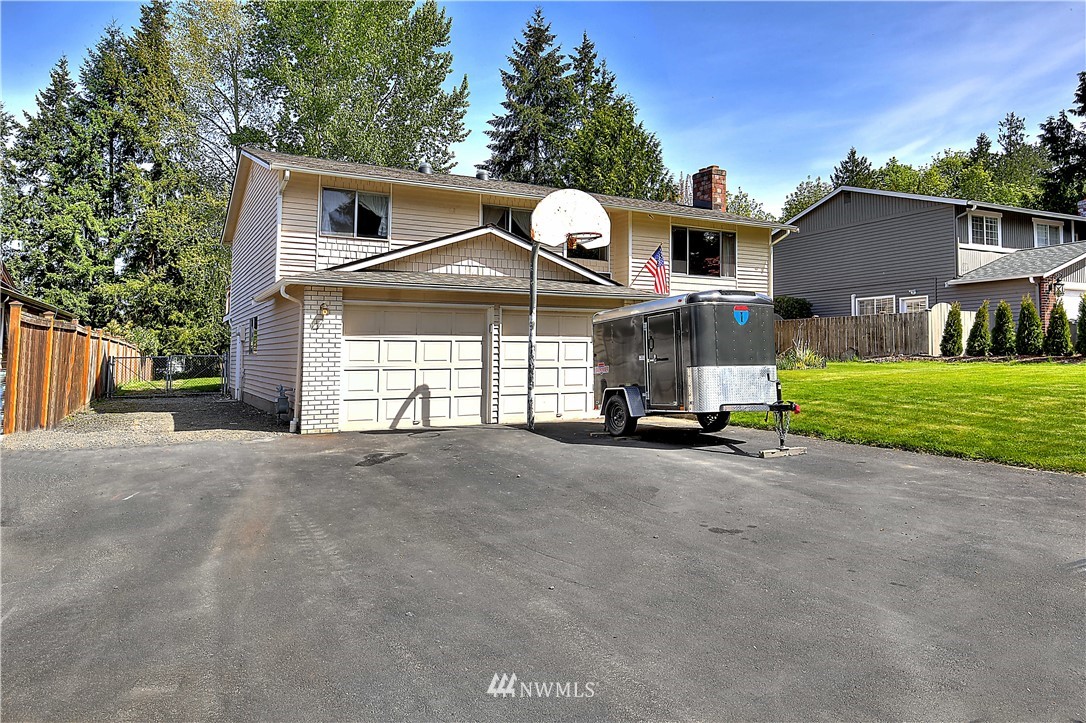 10020 Northeast 204th Street Bothell, WA 98011 - Photo 30 of 30 a front view of a house with a yard and garage