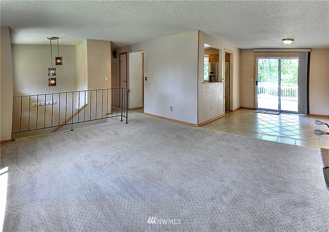10020 Northeast 204th Street Bothell, WA 98011 - Photo 5 of 30 an empty room with windows