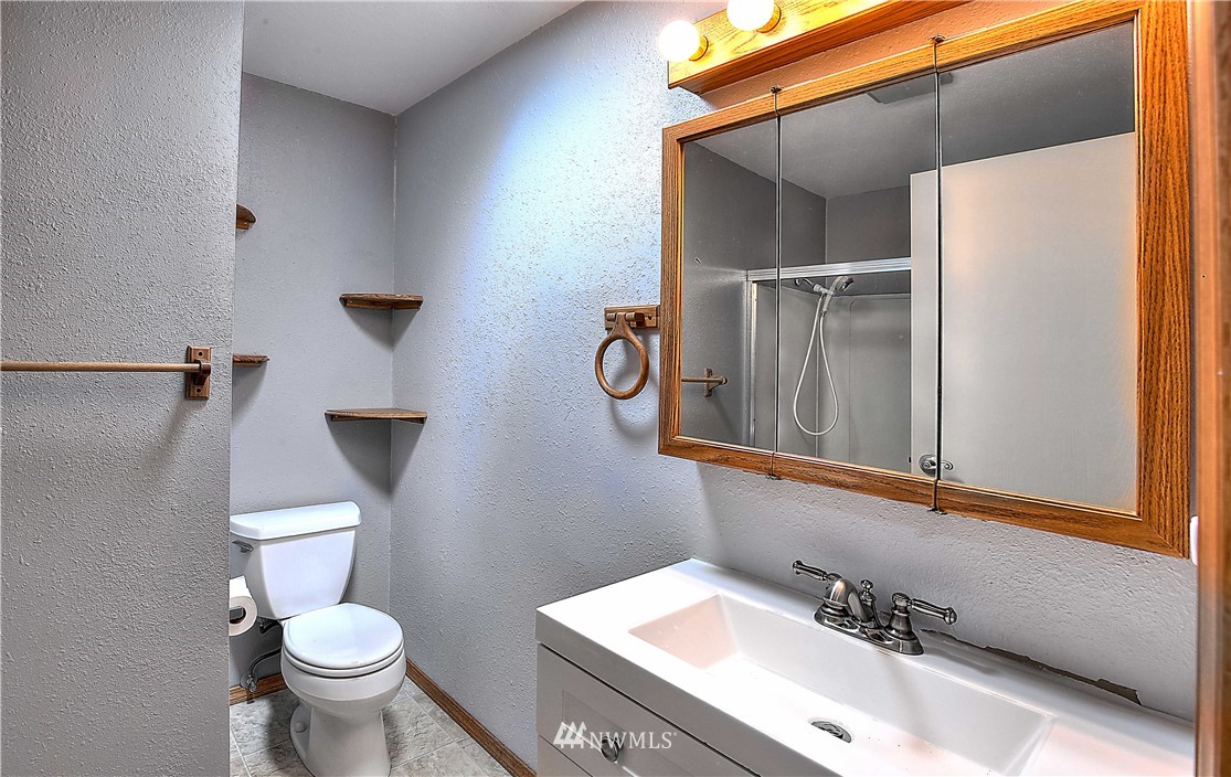 10020 Northeast 204th Street Bothell, WA 98011 - Photo 9 of 30 a bathroom with a sink and a toilet