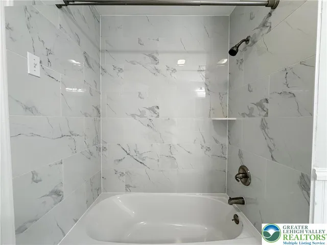 a bathroom with a bathtub