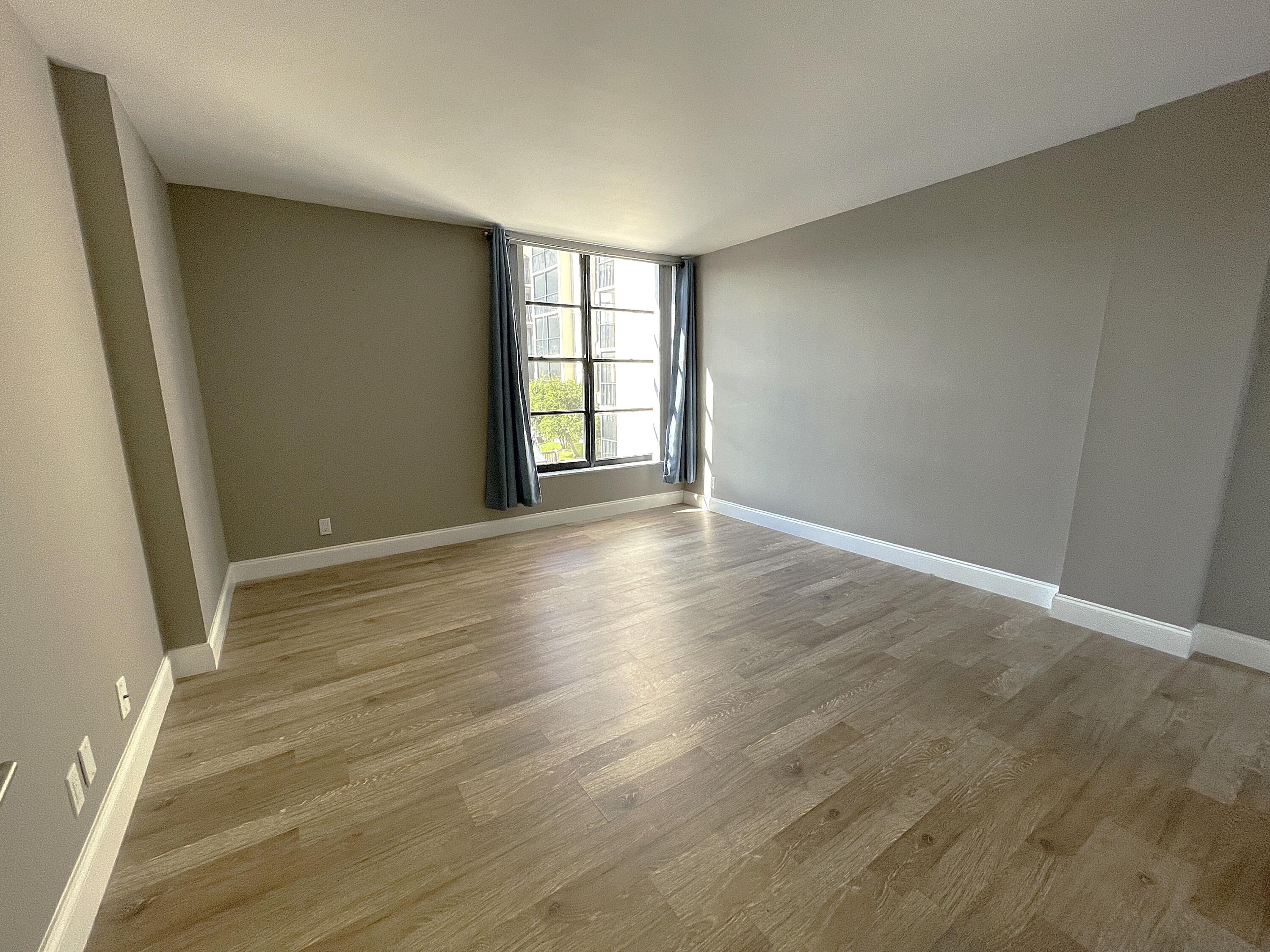 3 Royal Palm Way, Unit 2050 Boca Raton, FL 33432 - Photo 11 of 25 wooden floor in an empty room with a window