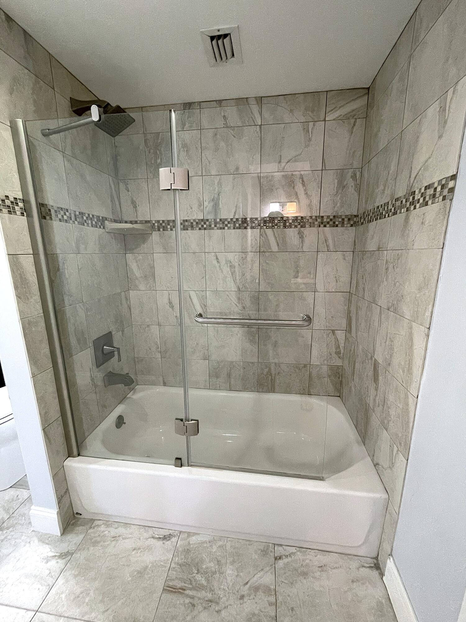 3 Royal Palm Way, Unit 2050 Boca Raton, FL 33432 - Photo 13 of 25 a white bath tub sitting next to a shower