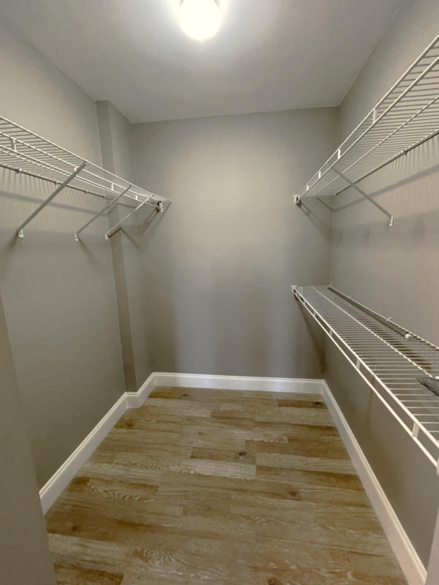 3 Royal Palm Way, Unit 2050 Boca Raton, FL 33432 - Photo 15 of 25 a view of a room with racks on the wall