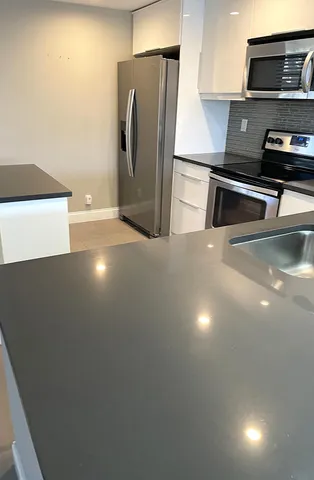 a view of a room with a ceiling fan