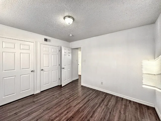 a view of a livingroom with wooden floor
