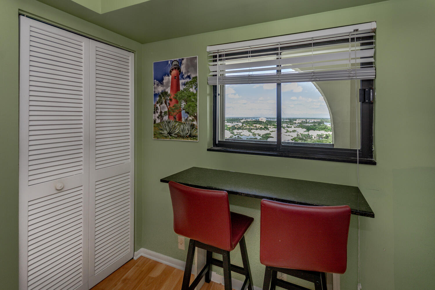 400 Ocean Trail Way, Unit 1405 Jupiter, FL 33477 - Photo 15 of 41 a room that has a table chair and a window