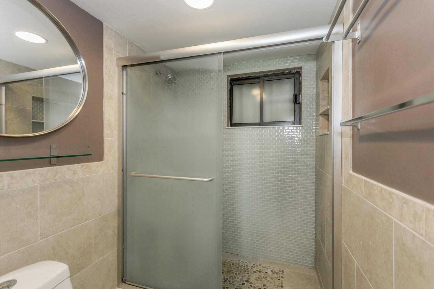 400 Ocean Trail Way, Unit 1405 Jupiter, FL 33477 - Photo 23 of 41 a bathroom with a toilet and a mirror