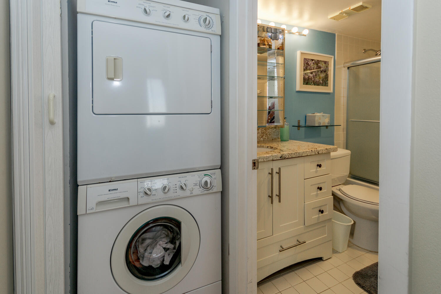400 Ocean Trail Way, Unit 1405 Jupiter, FL 33477 - Photo 27 of 41 a bathroom with a granite countertop toilet and a shower