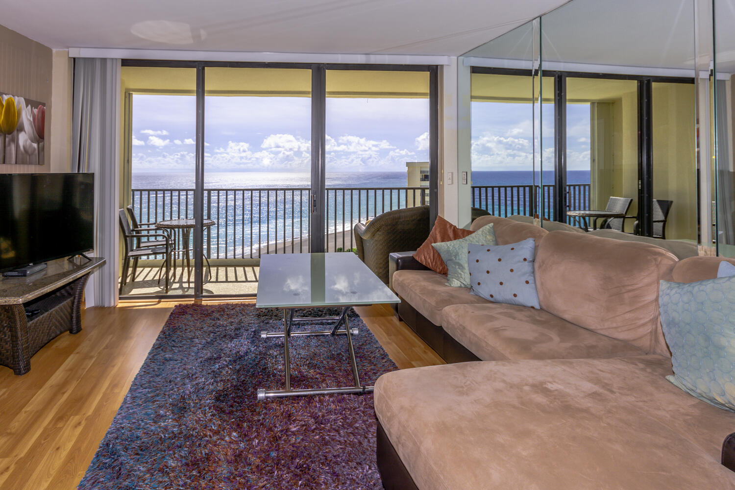 400 Ocean Trail Way, Unit 1405 Jupiter, FL 33477 - Photo 6 of 41 a living room with large windows and a flat screen tv