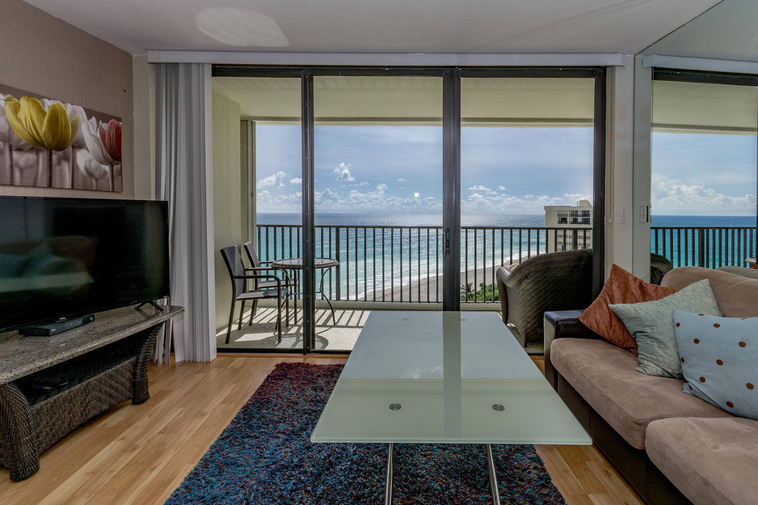 400 Ocean Trail Way, Unit 1405 Jupiter, FL 33477 - Photo 7 of 41 a living room with furniture tv and a flat screen tv