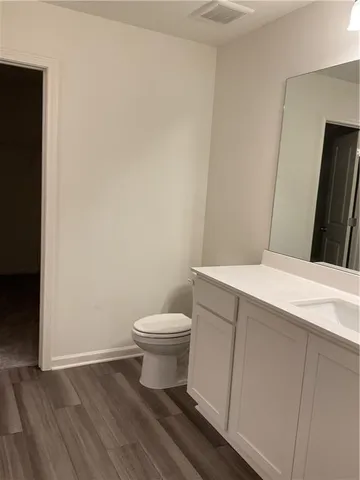 a bathroom with a toilet and a sink