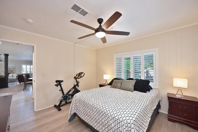 a bedroom with a bed and a dresser