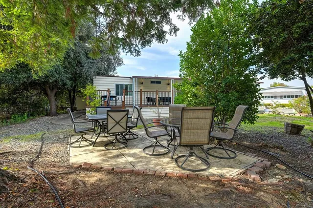 a view of a house with a trees in front of it