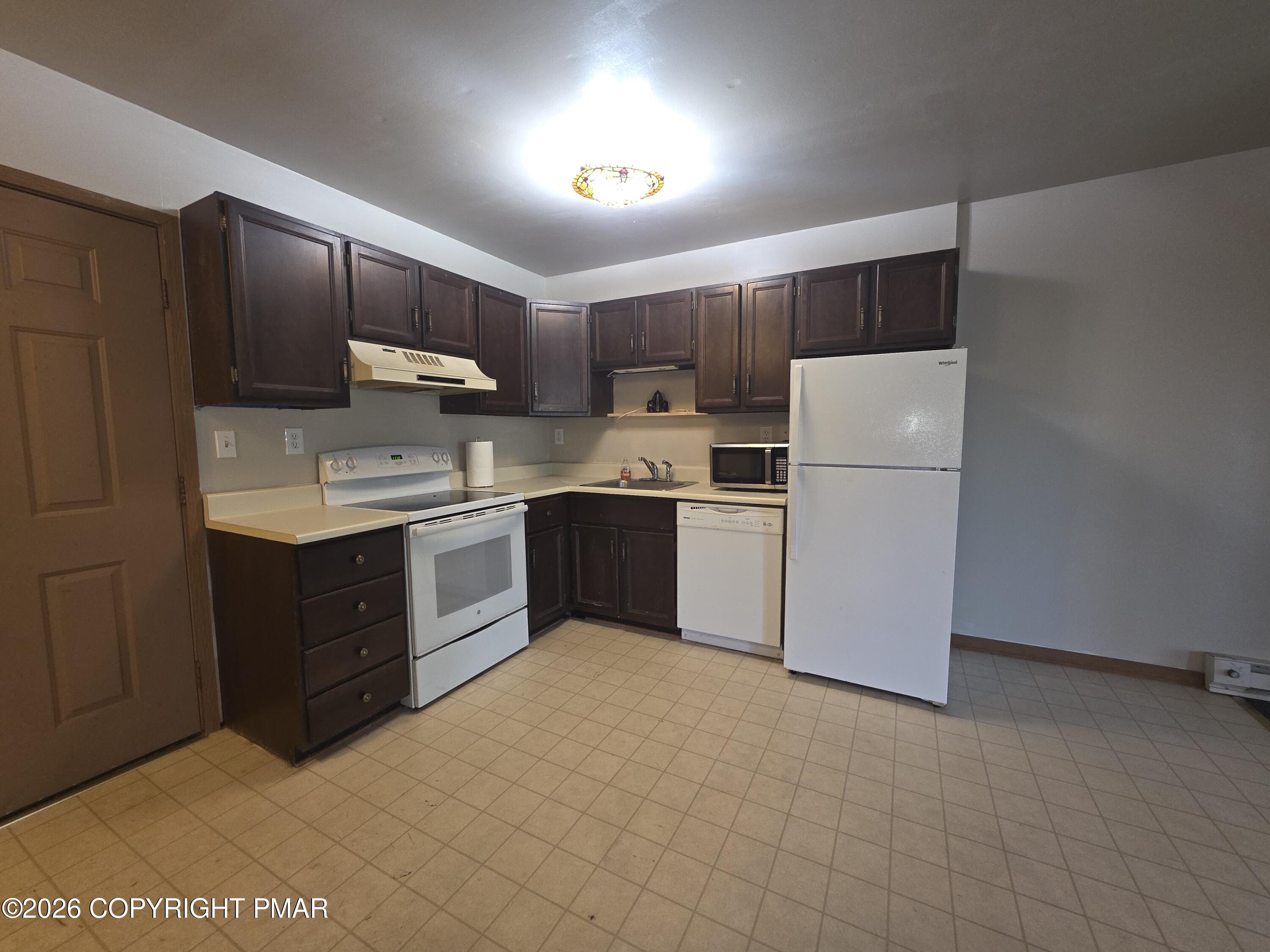 317 Keswick Avenue Bushkill, PA 18324 - Photo 14 of 21 a kitchen with stainless steel appliances granite countertop a refrigerator sink and cabinets