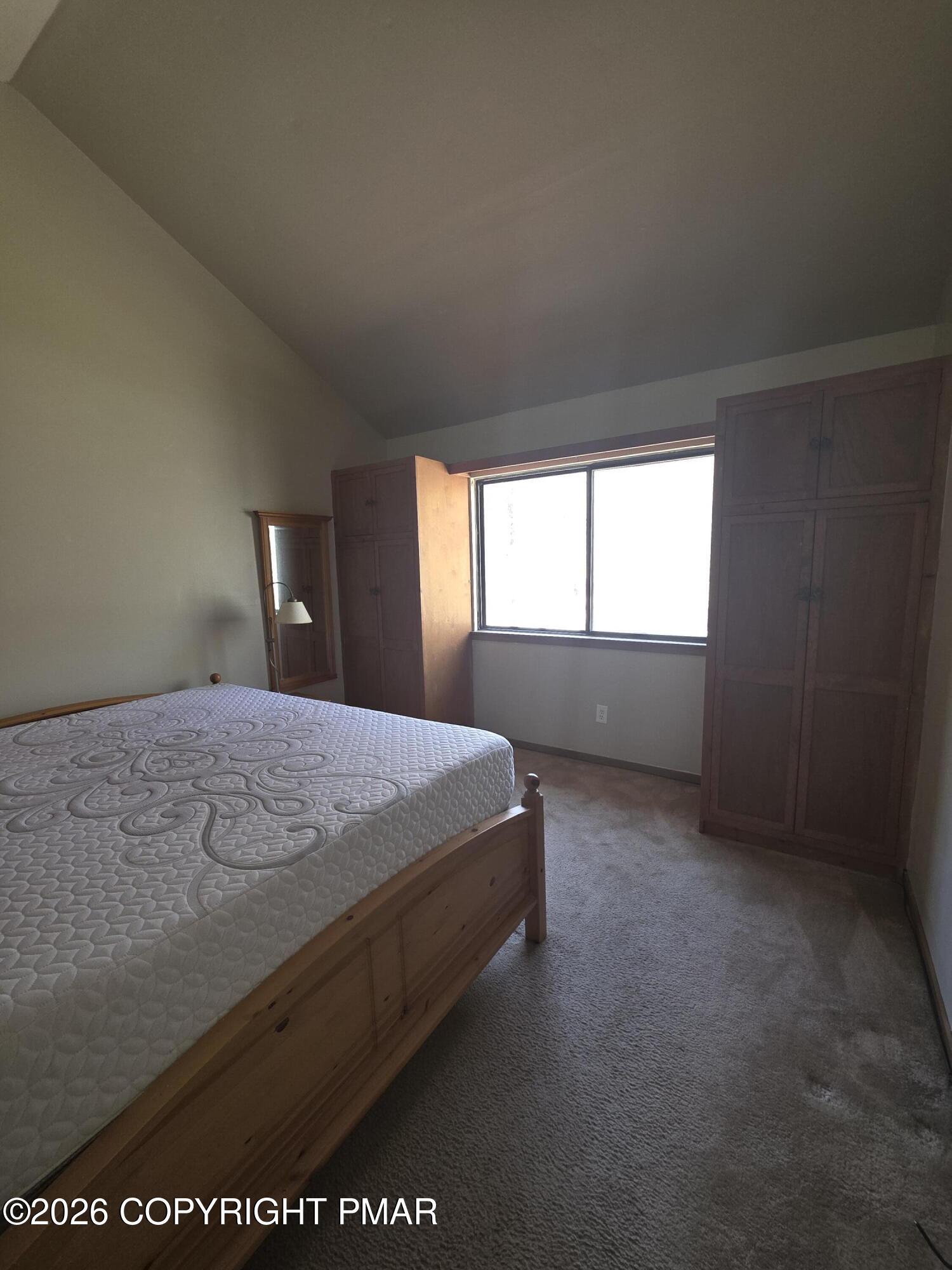 317 Keswick Avenue Bushkill, PA 18324 - Photo 18 of 21 a bed sitting in a bedroom next to a window