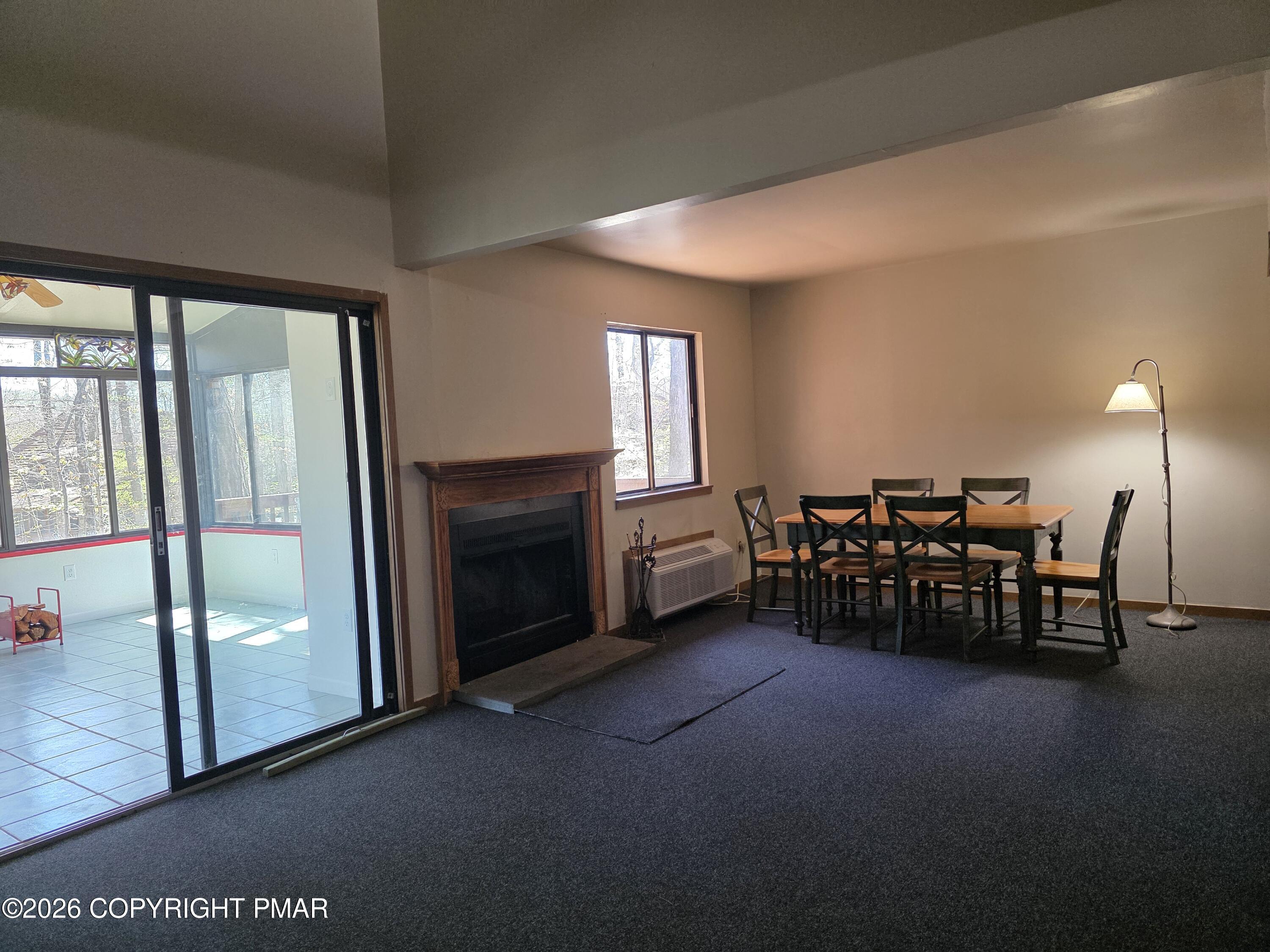 317 Keswick Avenue Bushkill, PA 18324 - Photo 5 of 21 a living room with furniture and a floor to ceiling window