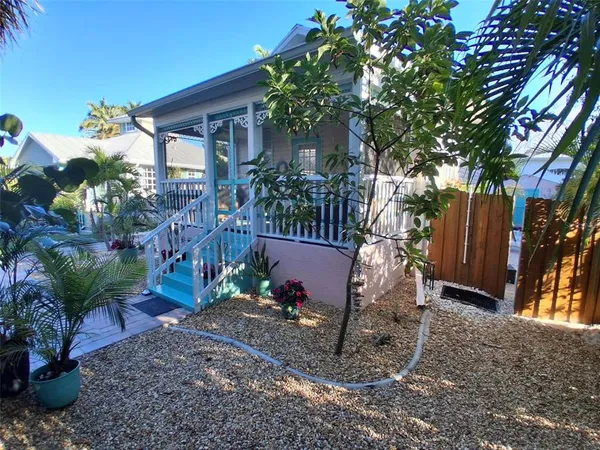 a view of a backyard with sitting area