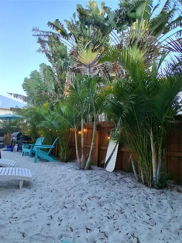a bedroom with a bed and a night stand