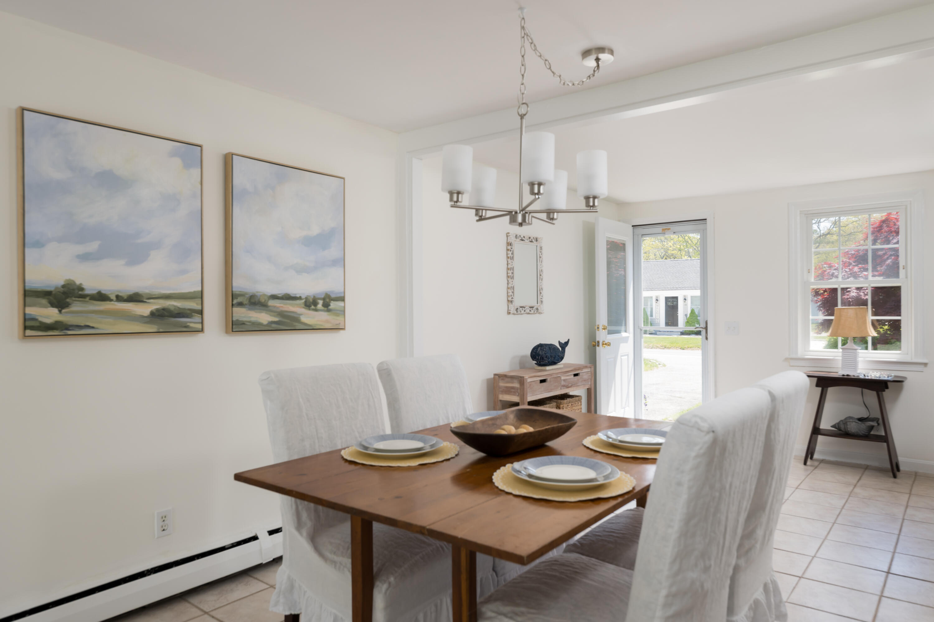 111 Lewis Road West Yarmouth, MA 02673 - Photo 11 of 43 a view of a dining room with furniture window and wooden floor
