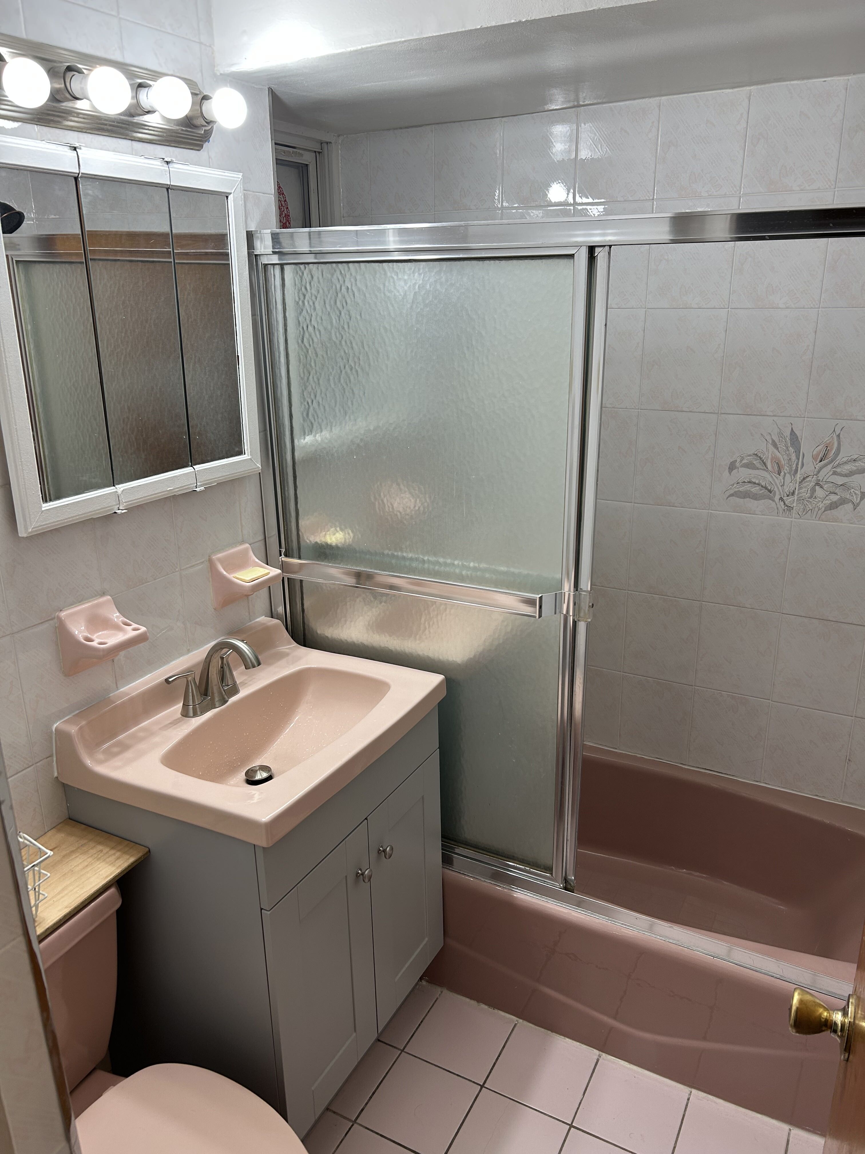 839 53rd Street, Unit 1 Brooklyn, NY 11220 - Photo 4 of 10 a bathroom with a sink a toilet and shower