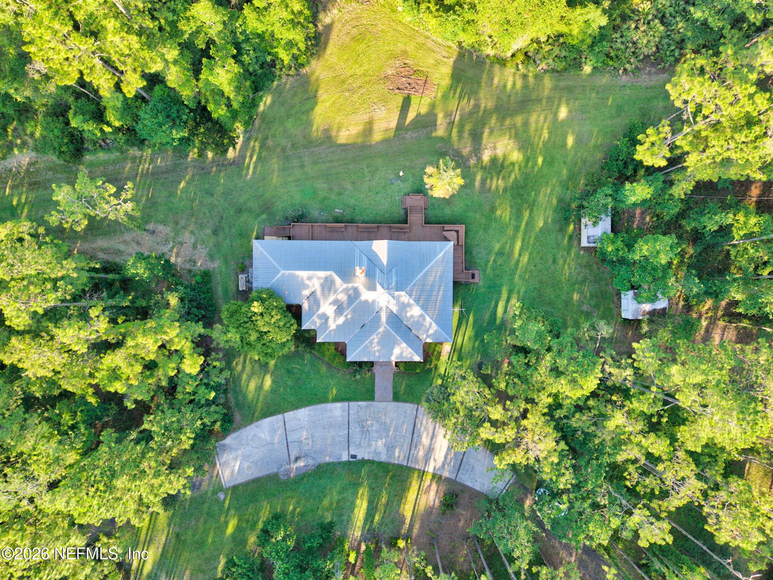 3090 Monument Bay Road St. Augustine, FL 32092 - Photo 52 of 56 a view of a yard with plants and large trees