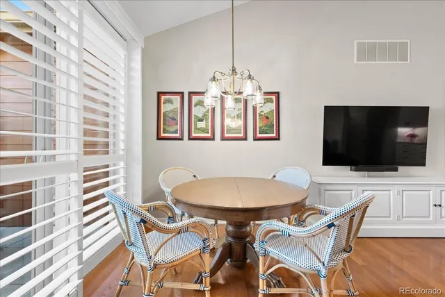 a dining room with furniture and window