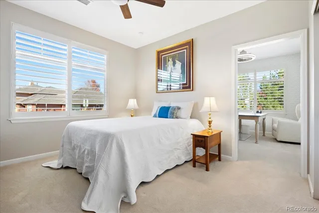 a bedroom with a bed and a couch