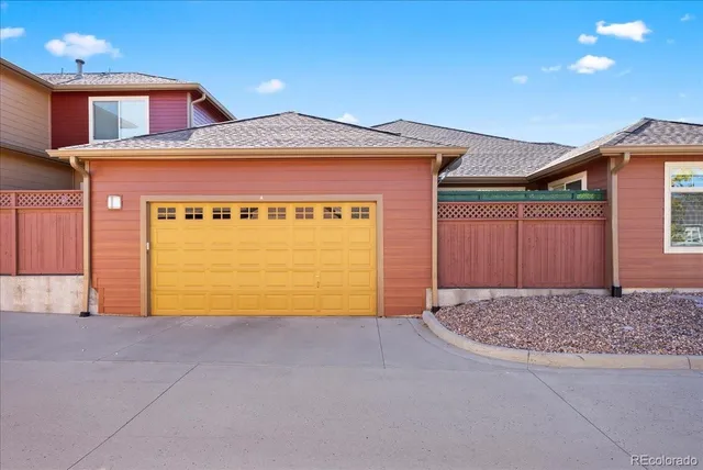 a front view of a house with a garage and window
