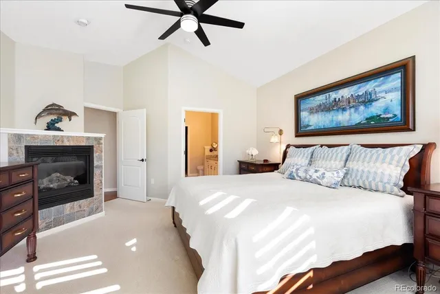 a bedroom with a bed and a fireplace