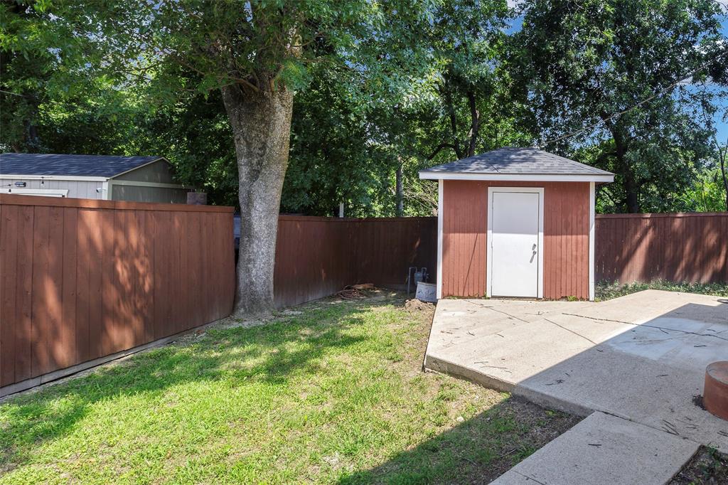 2323 Sutter Street Dallas, TX 75216 - Photo 29 of 30 View of backyard with a shed