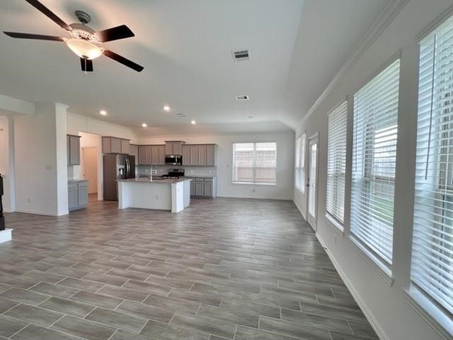 4826 Albany Ridge Lane Rosharon, TX 77583 - Photo 9 of 37 a view of kitchen with a refrigerator cabinets and wooden floor