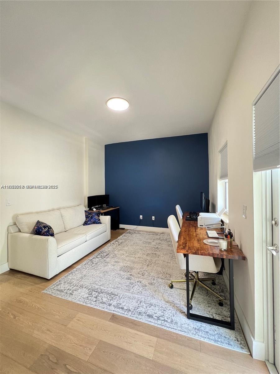 1043 Southwest 9th Court, Unit F1 Miami, FL 33130 - Photo 18 of 27 a living room with furniture and a rug