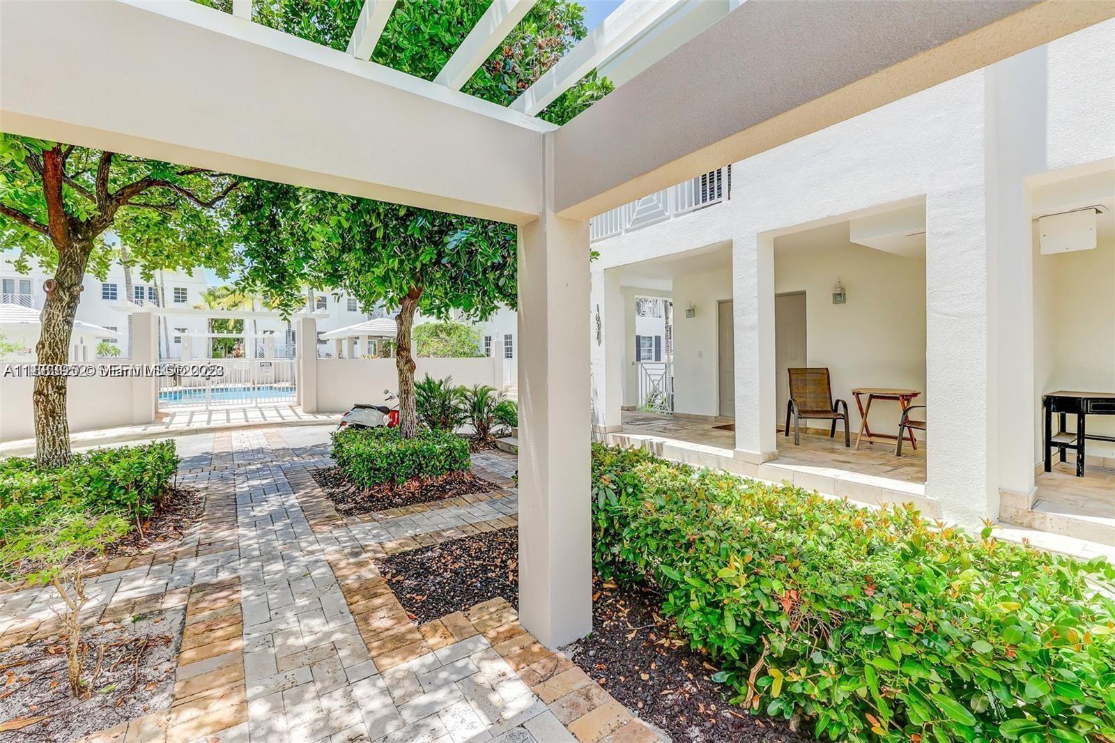 1043 Southwest 9th Court, Unit F1 Miami, FL 33130 - Photo 24 of 27 a front view of a house with garden