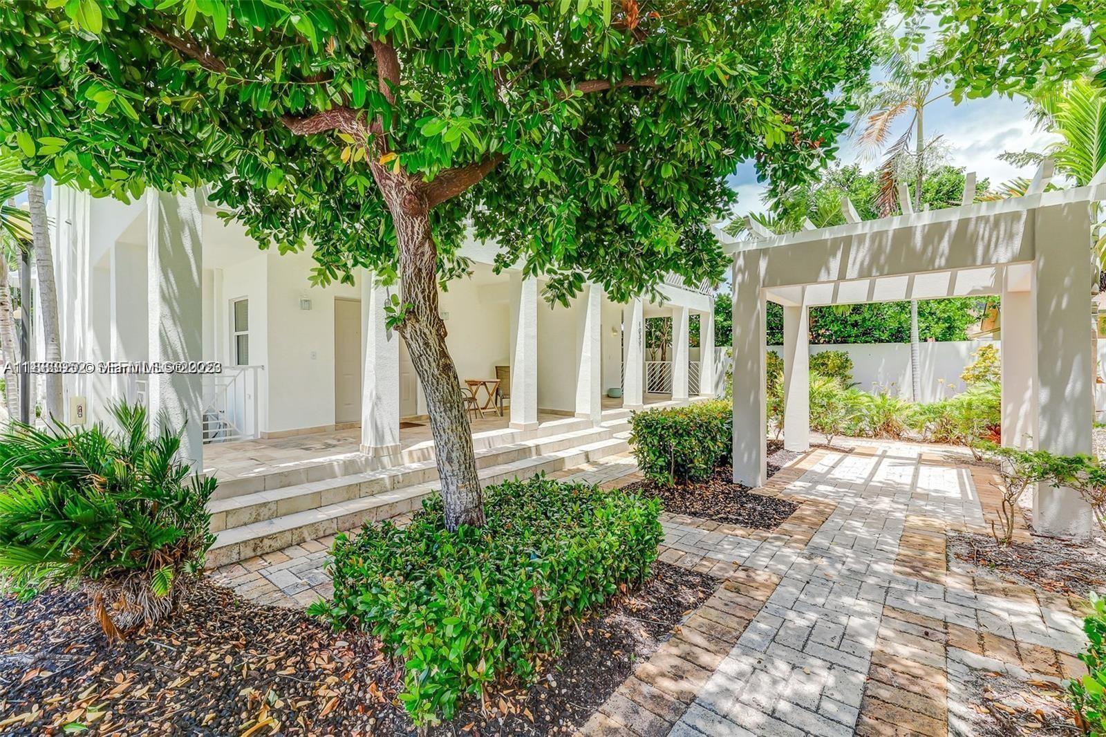 1043 Southwest 9th Court, Unit F1 Miami, FL 33130 - Photo 25 of 27 a front view of a house with garden