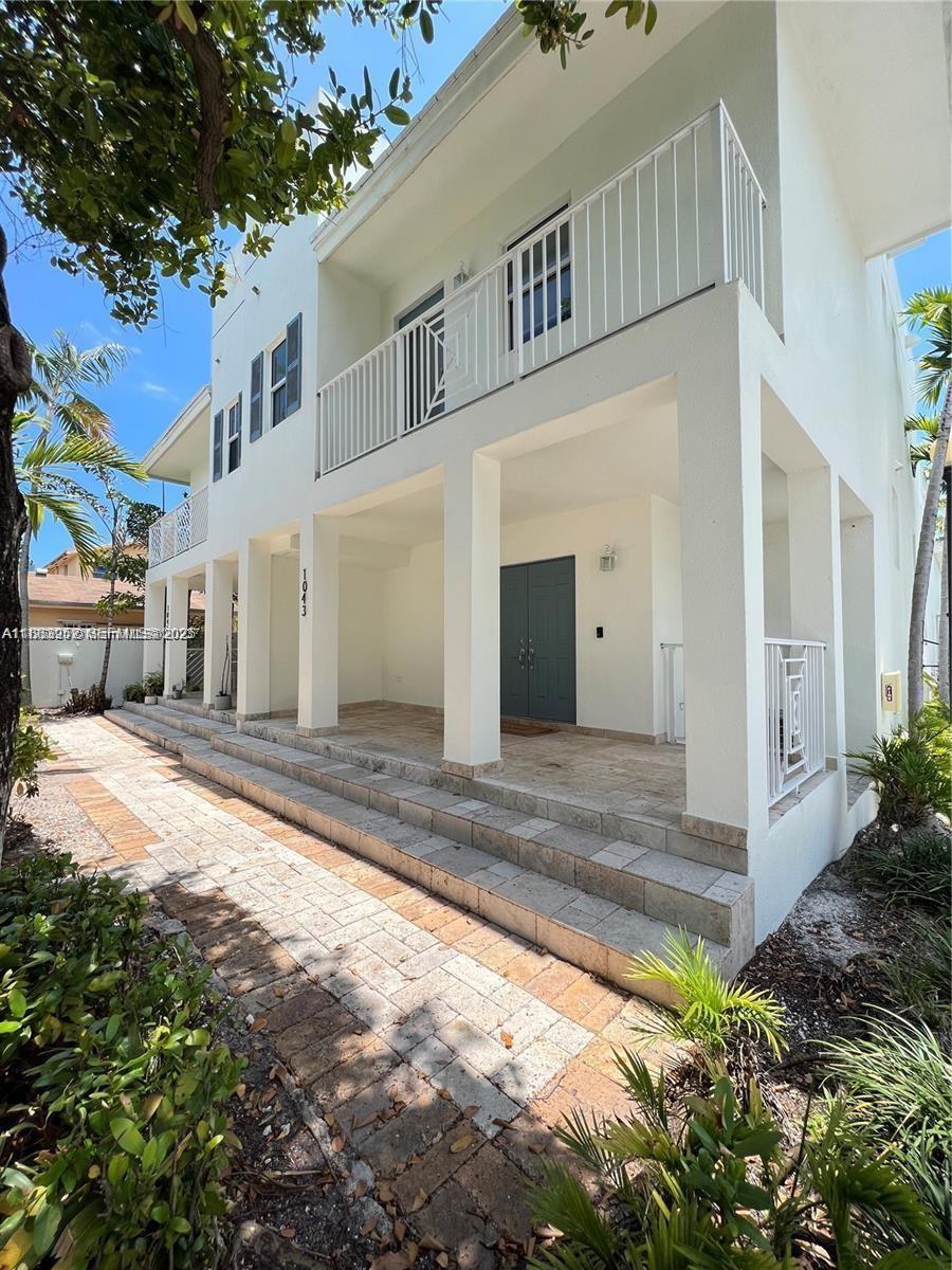 1043 Southwest 9th Court, Unit F1 Miami, FL 33130 - Photo 3 of 27 a view of a house with a yard