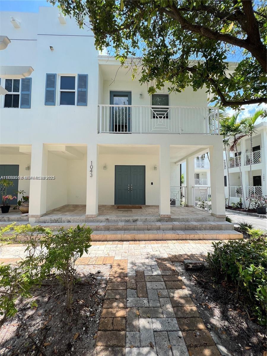 1043 Southwest 9th Court, Unit F1 Miami, FL 33130 - Photo 4 of 27 a front view of a house with garden