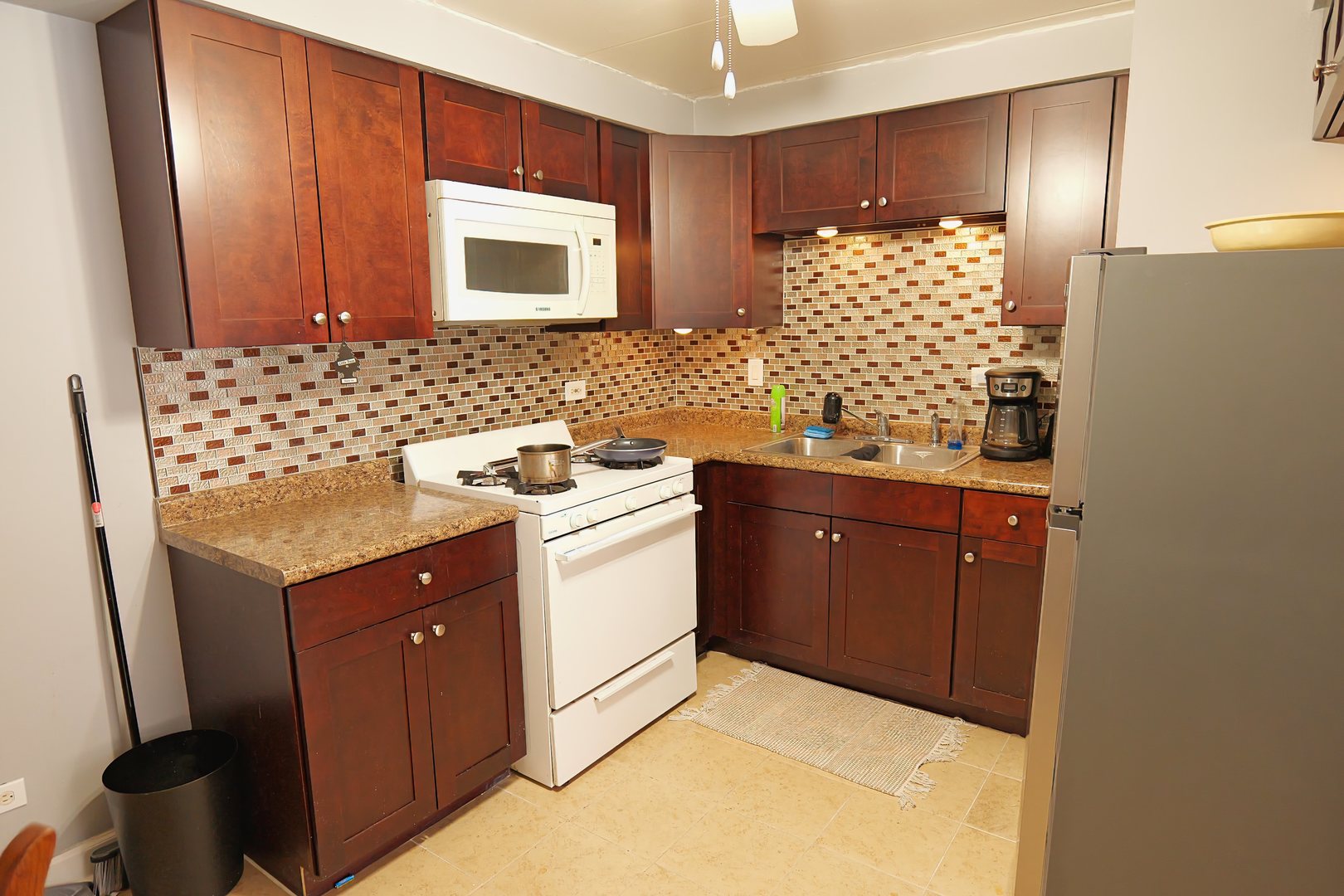 10811 South Lloyd Drive, Unit 3 Worth, IL 60482 - Photo 3 of 8 a bathroom with a sink and a mirror