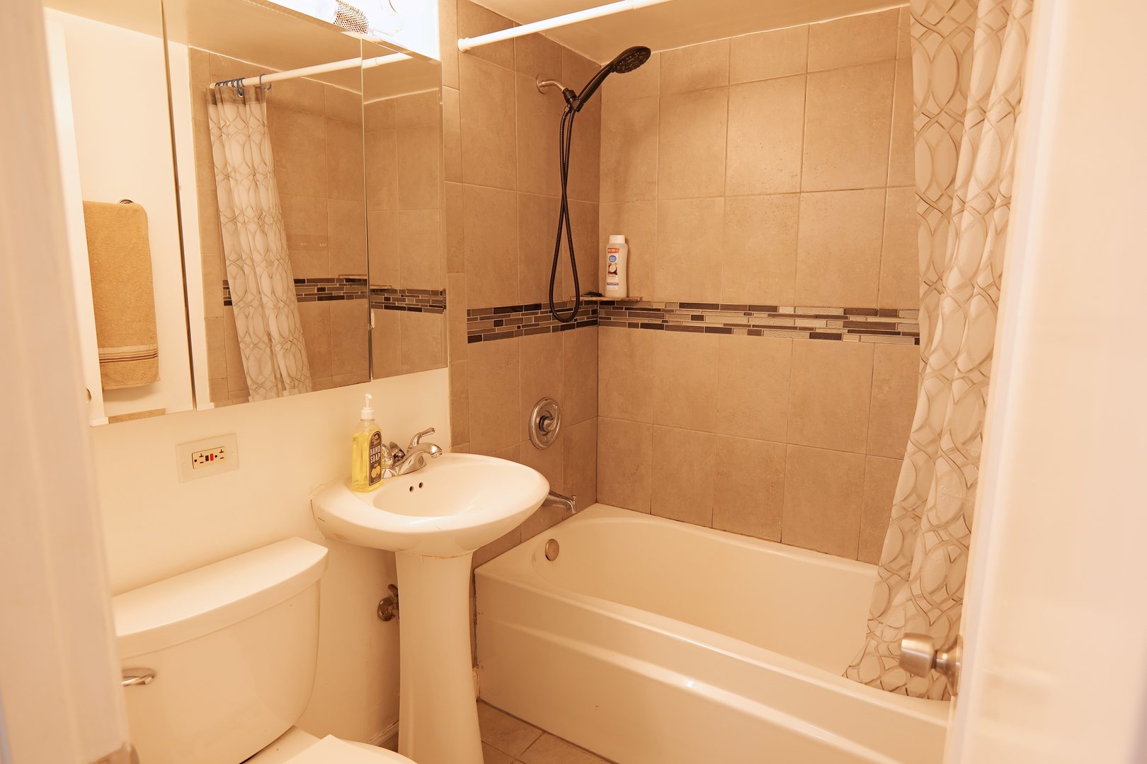 10811 South Lloyd Drive, Unit 3 Worth, IL 60482 - Photo 6 of 8 a bathroom with a sink a toilet and shower