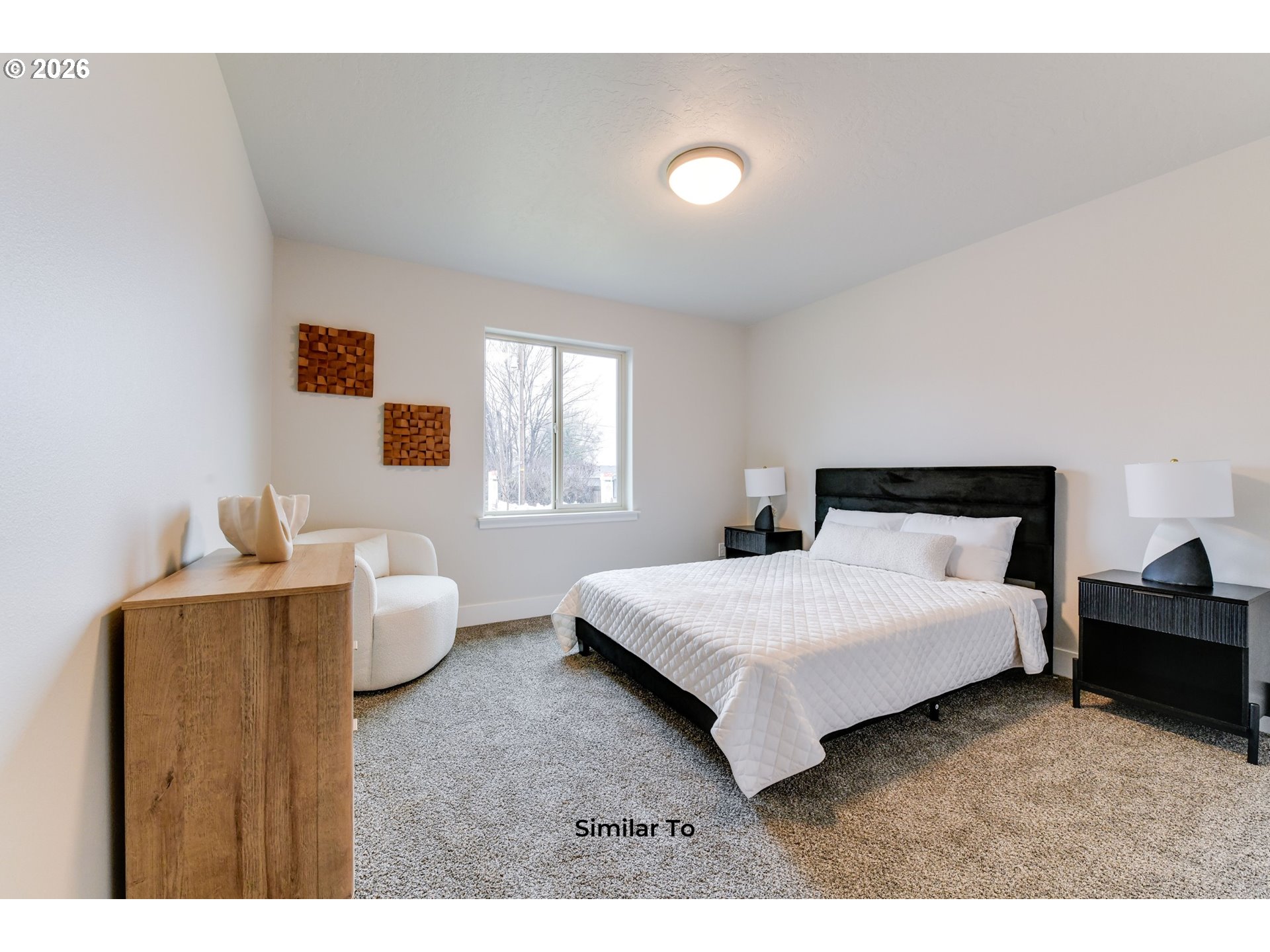 227 Southwest Goldfinch Lane Boardman, OR 97818 - Photo 11 of 28 a bedroom with a bed and window