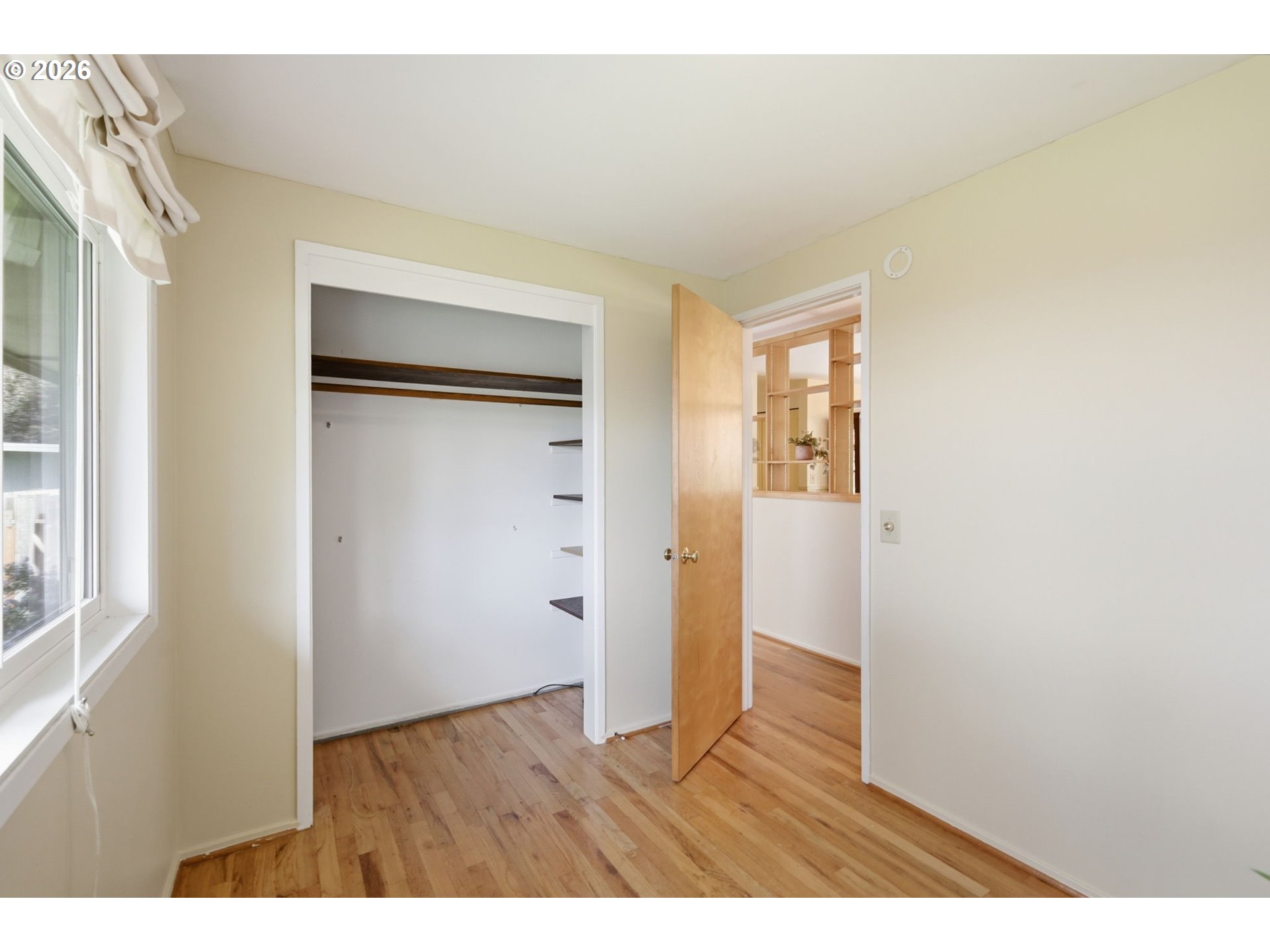 3025 Harris Street Eugene, OR 97405 - Photo 27 of 44 a view of an empty room with wooden floor and a window