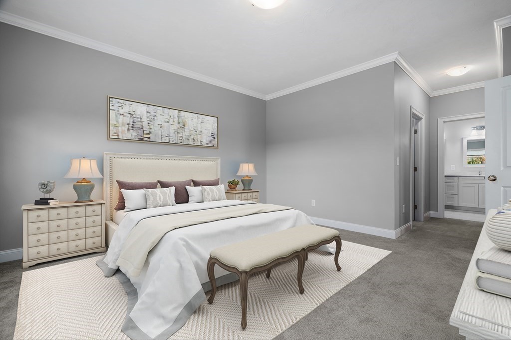 159 Rolling Rdg Drive, Unit 85 Northbridge, MA 01588 - Photo 14 of 25 a bedroom with a bed and a lamp on table