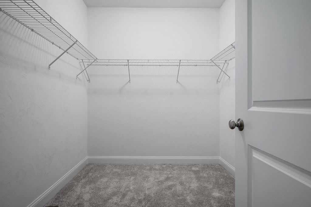 159 Rolling Rdg Drive, Unit 85 Northbridge, MA 01588 - Photo 16 of 25 a view of a room with racks on the wall