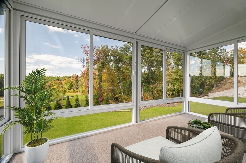 159 Rolling Rdg Drive, Unit 85 Northbridge, MA 01588 - Photo 19 of 25 a living room with a large window and a floor to ceiling window