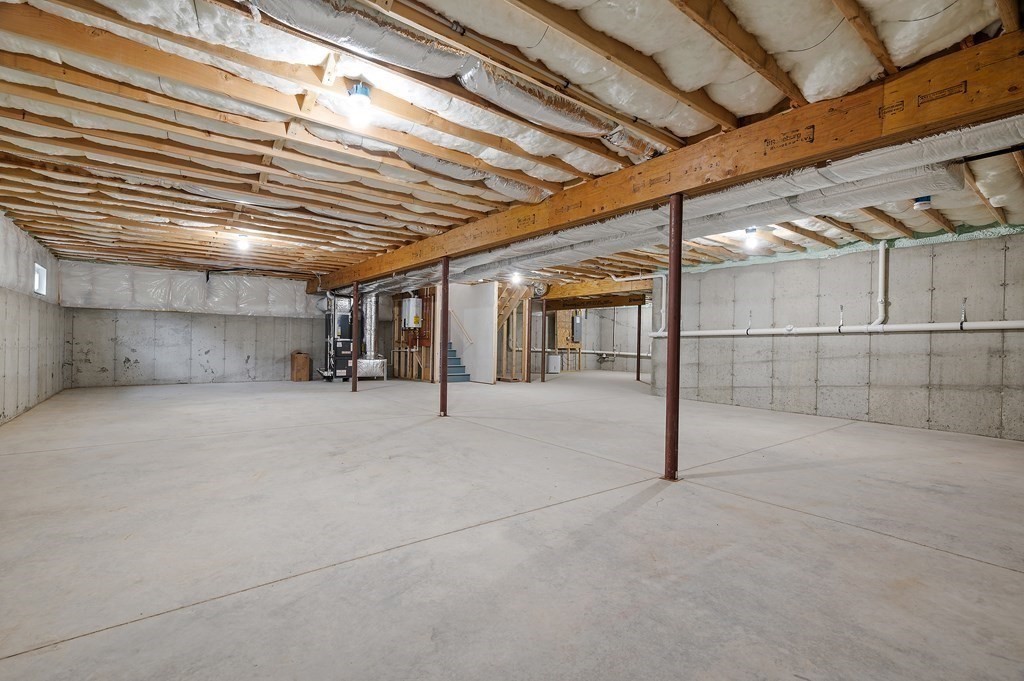 159 Rolling Rdg Drive, Unit 85 Northbridge, MA 01588 - Photo 21 of 25 a view of empty room with wooden ceiling