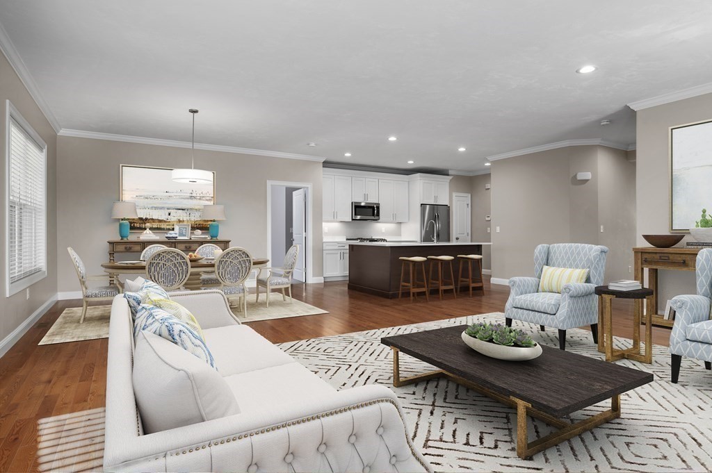 159 Rolling Rdg Drive, Unit 85 Northbridge, MA 01588 - Photo 6 of 25 a living room with furniture and a wooden floor