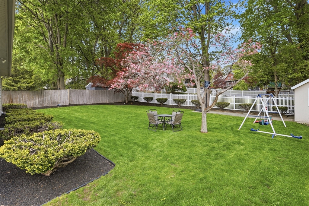 115 Collincote Street Stoneham, MA 02180 - Photo 23 of 25 a view of a backyard with a slide