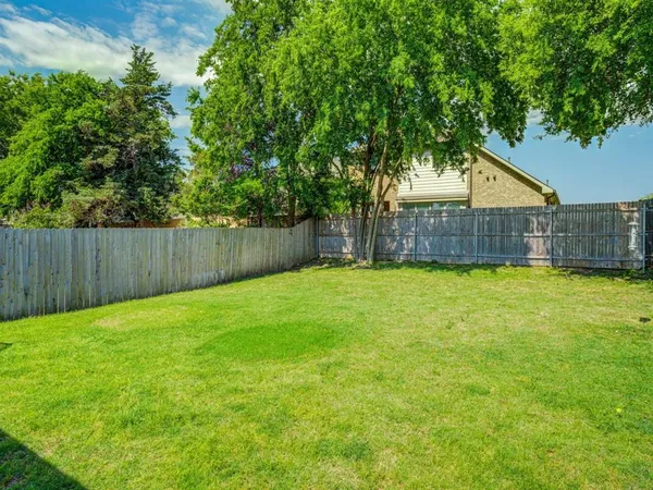 a view of a back yard of the house