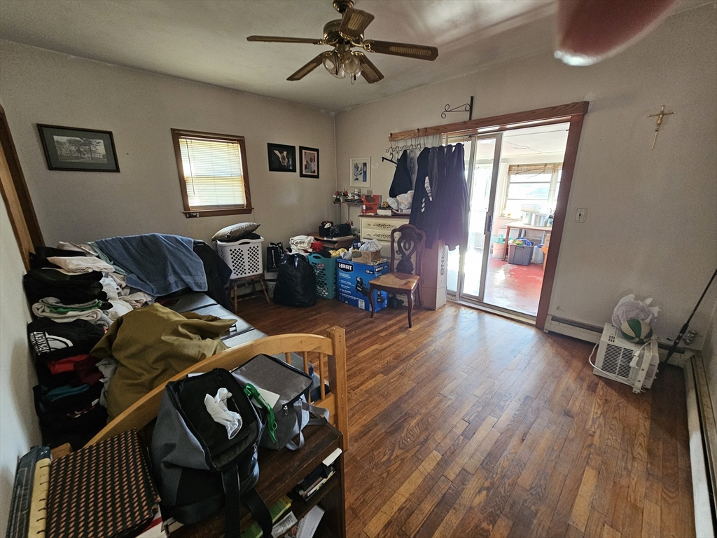 65 Beattie Street Fall River, MA 02723 - Photo 9 of 10 a living room with furniture and a wooden floor