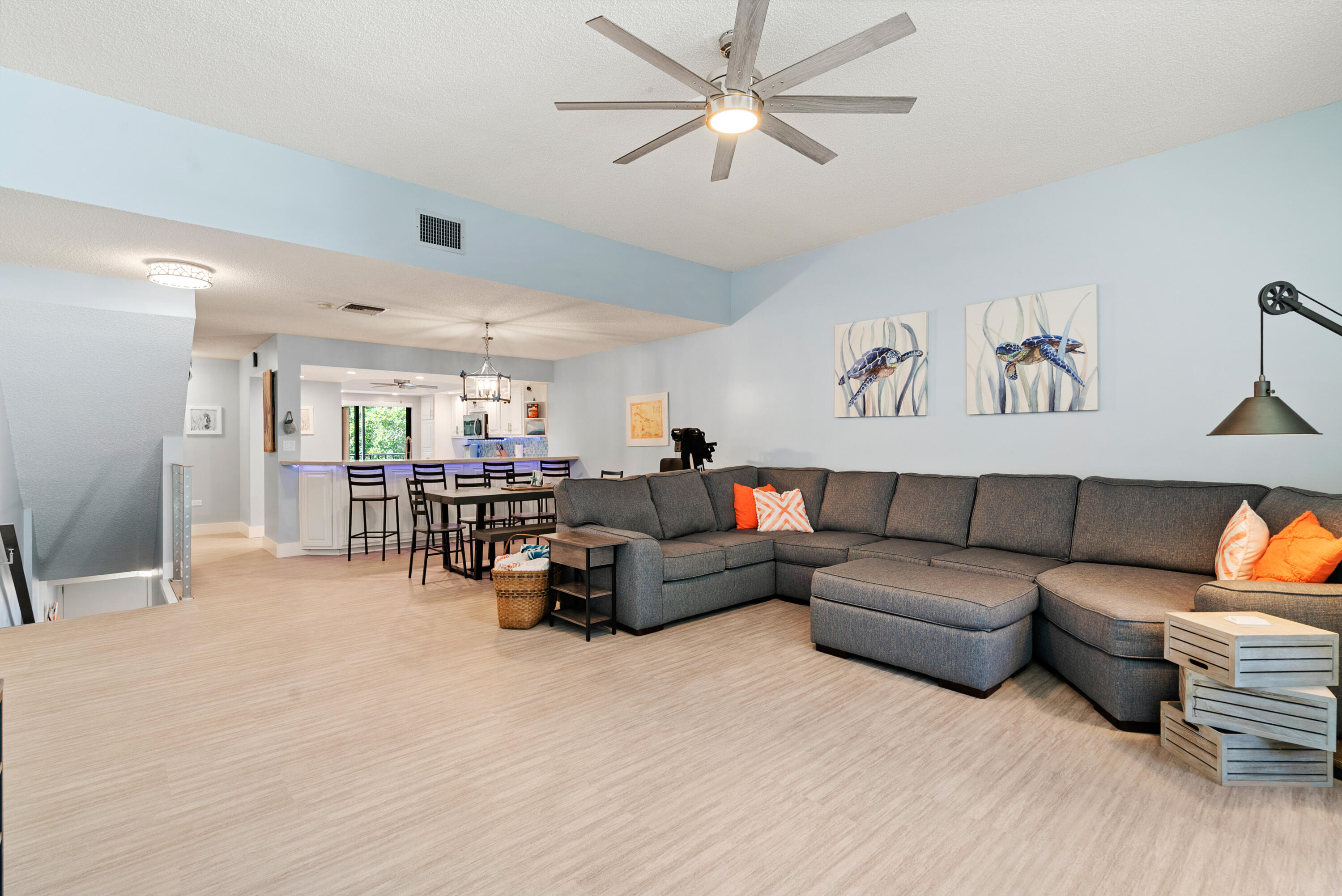 94220 Overseas Highway, Unit 5E Tavernier, FL 33037 - Photo 13 of 77 a living room with furniture and a chandelier
