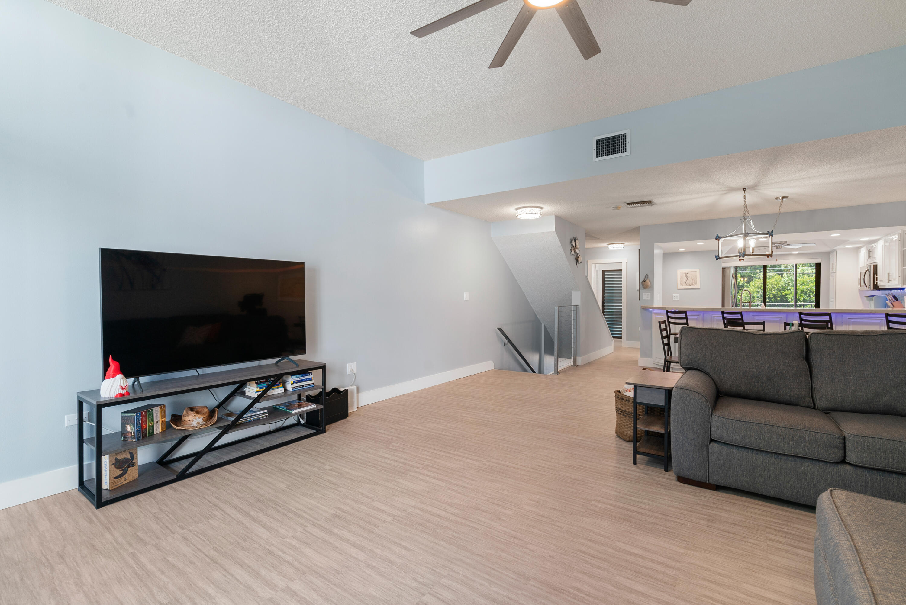 94220 Overseas Highway, Unit 5E Tavernier, FL 33037 - Photo 14 of 77 a living room with furniture and a flat screen tv
